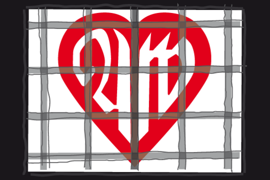 Das Foto zeigt das alte AWO Logo hinter Gittern