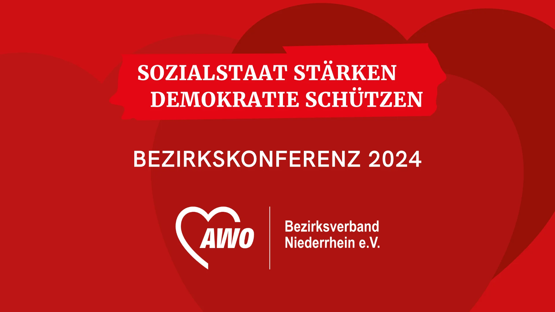 Das Foto zeigt in weißer Schrift auf rotem Hintergrund den Text " Sozialstaat stärken. Demokratie schützen."