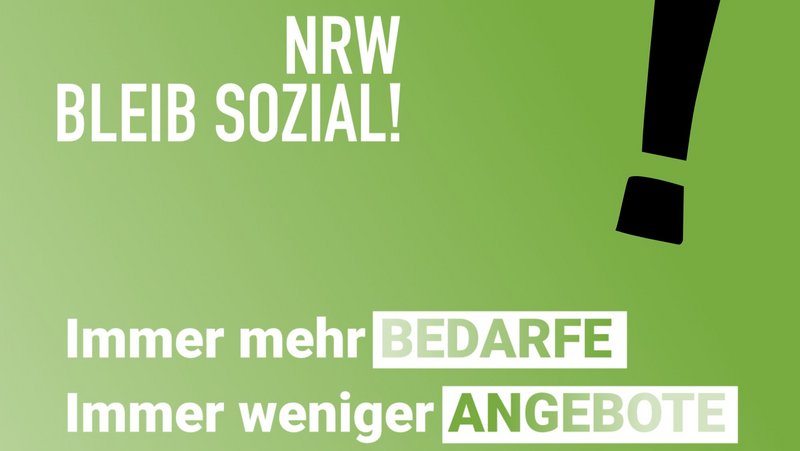 Das Foto zeigt eine Grafik mit dem Text "NRW bleib sozial! Immer weniger Bedarfe. Immer weniger Angebote